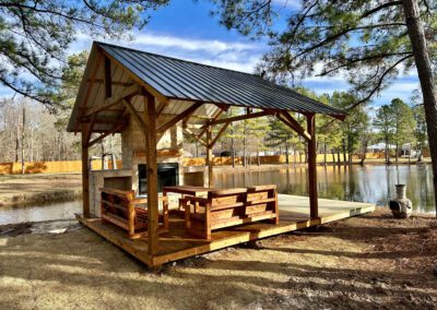 Outdoor patio featuring a wooden pergola and hot tub.