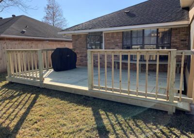 A cozy home featuring a deck and patio, perfect for outdoor relaxation and entertainment.