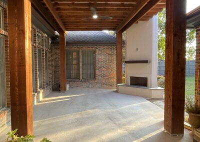 Relaxing hot tub under a wooden pergola on a patio.