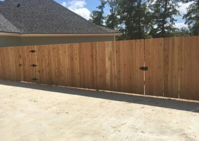 A fence featuring black wooden bars.